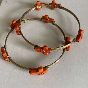Orange cross bangles